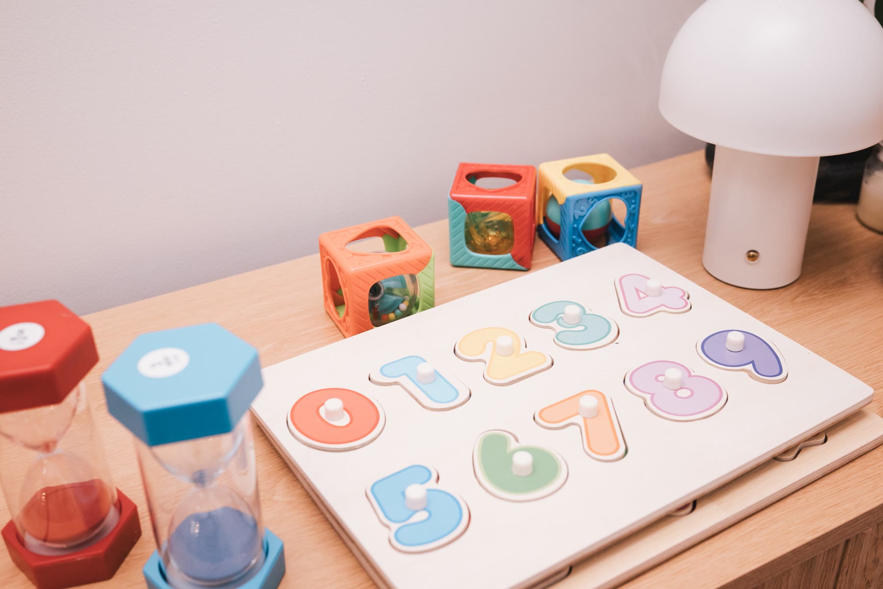 Hands sorting colourful therapy stickers during a session