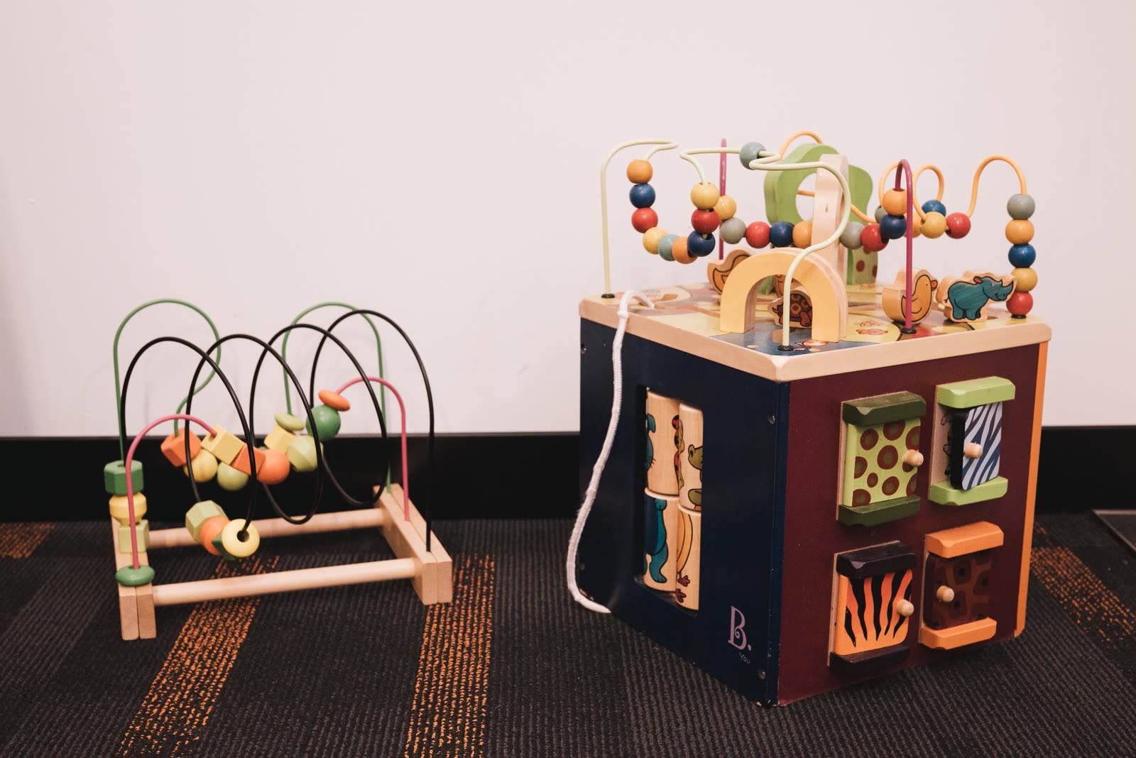 Colourful wooden bead-maze toys in the therapy room